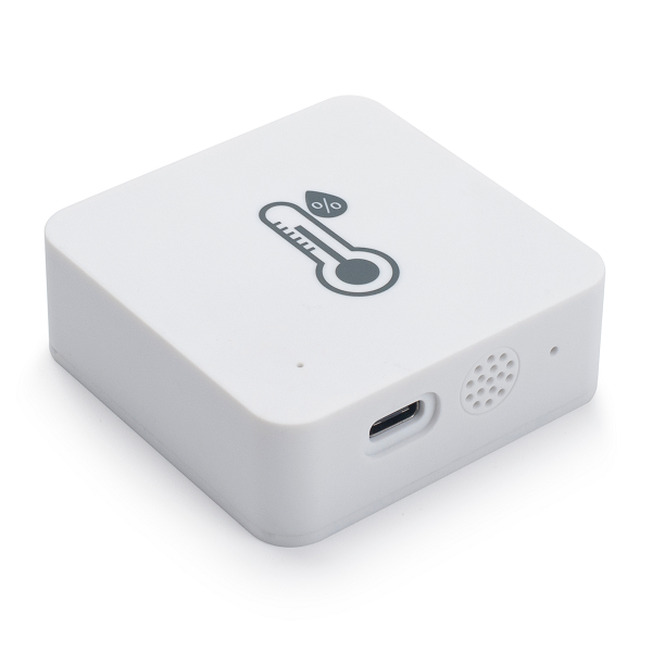 White temperature sensor with a thermometer decal on a white background